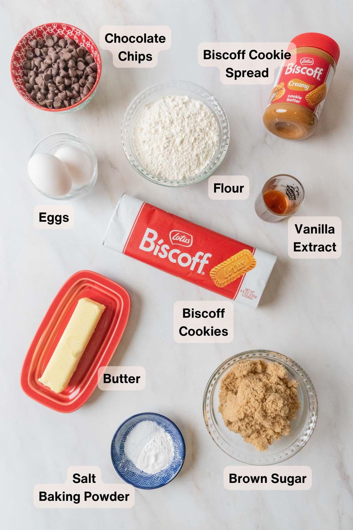 Ingredients for Chew Biscoff Blondies on a cream marble countertop.