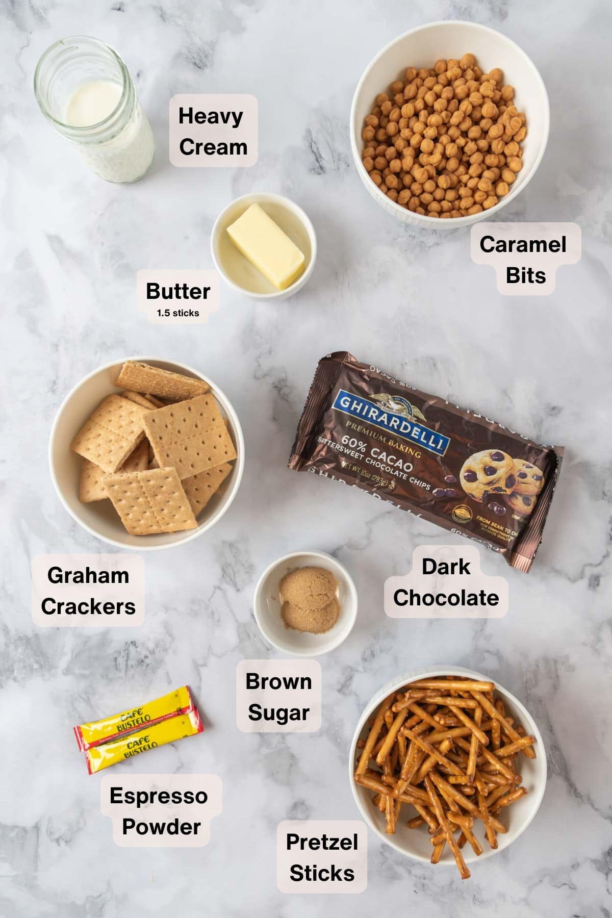Ingredients for Chocolate Espresso Salted Caramel Bars on a white marble countertop.