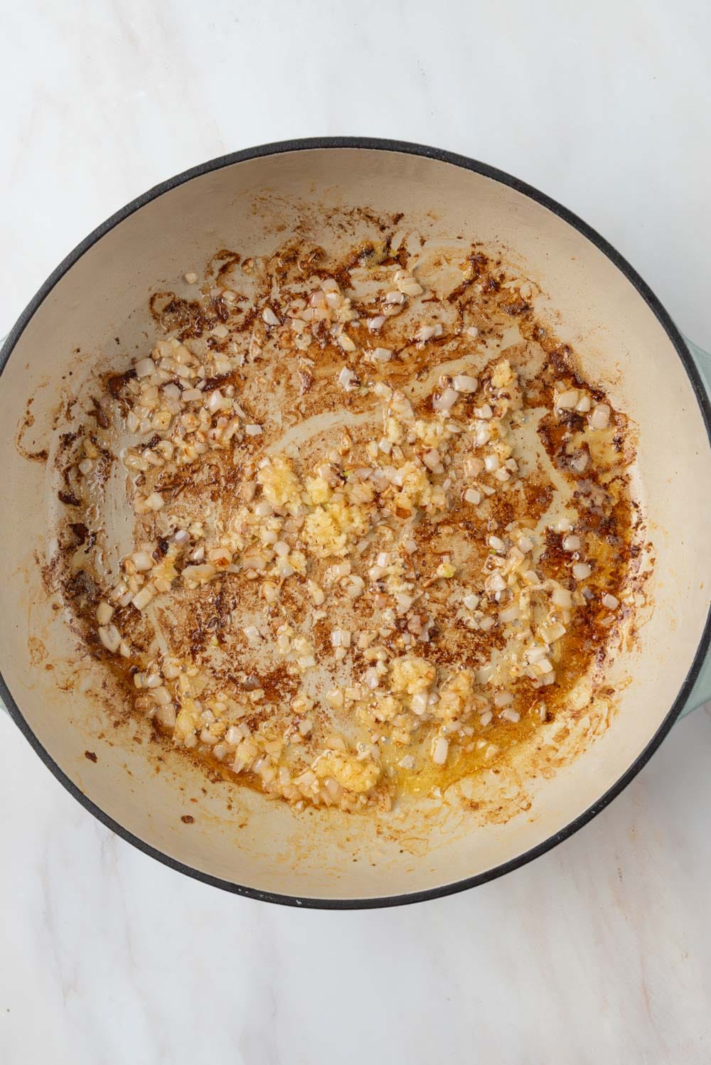 Aromatics, shallots and garlic, sautéing in butter.