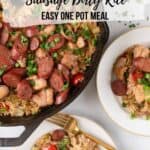 Chicken & Chicken Sausage Dirty Rice plated and ready to serve with the skillet filled with more to the side of the plate.